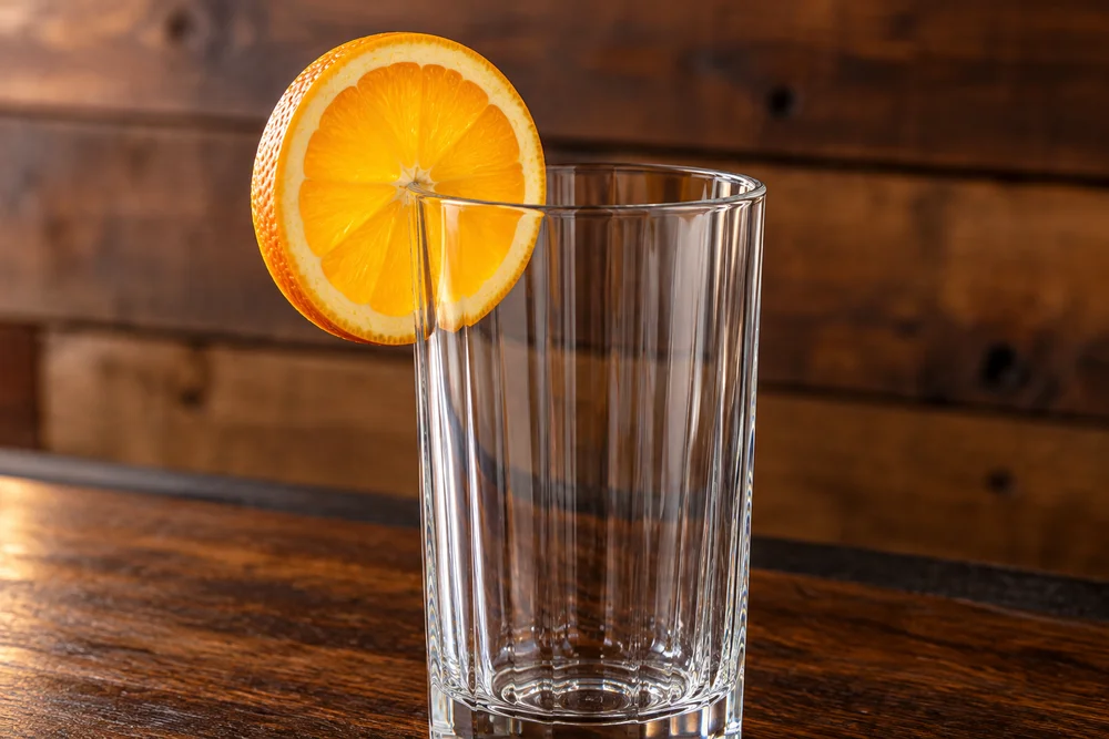 Harvey Wallbanger · Garnish on a wooden bar