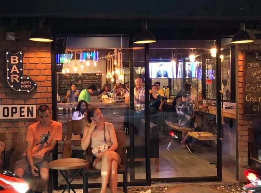 Guests at the illuminated bar entrance