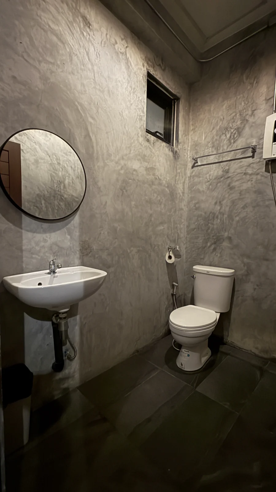 Private bathroom with basin and toilet