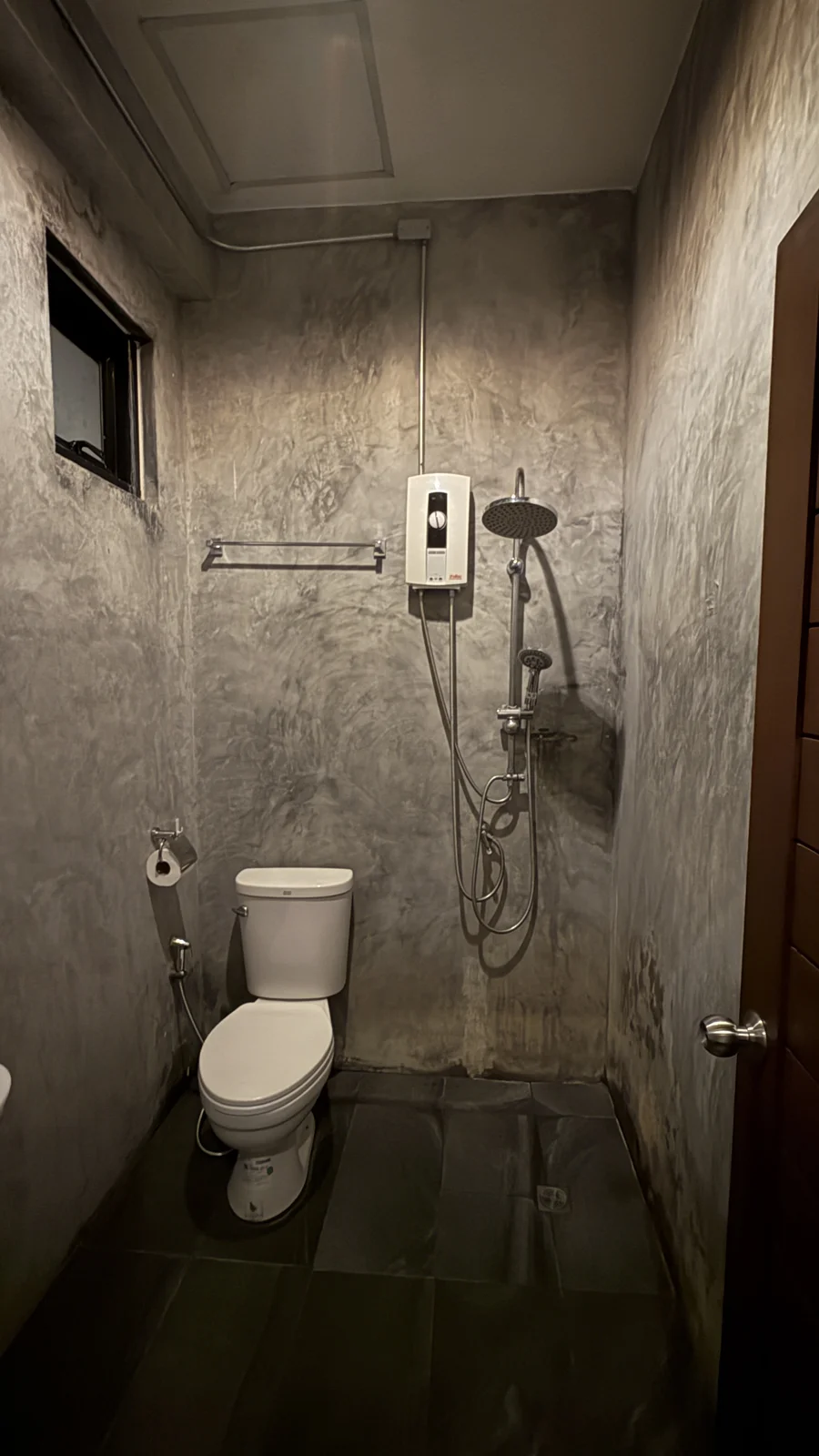 Private bathroom with shower and toilet